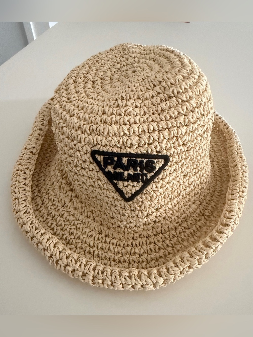 Paris Milano Straw Bucket Hat with Black Triangle Patch